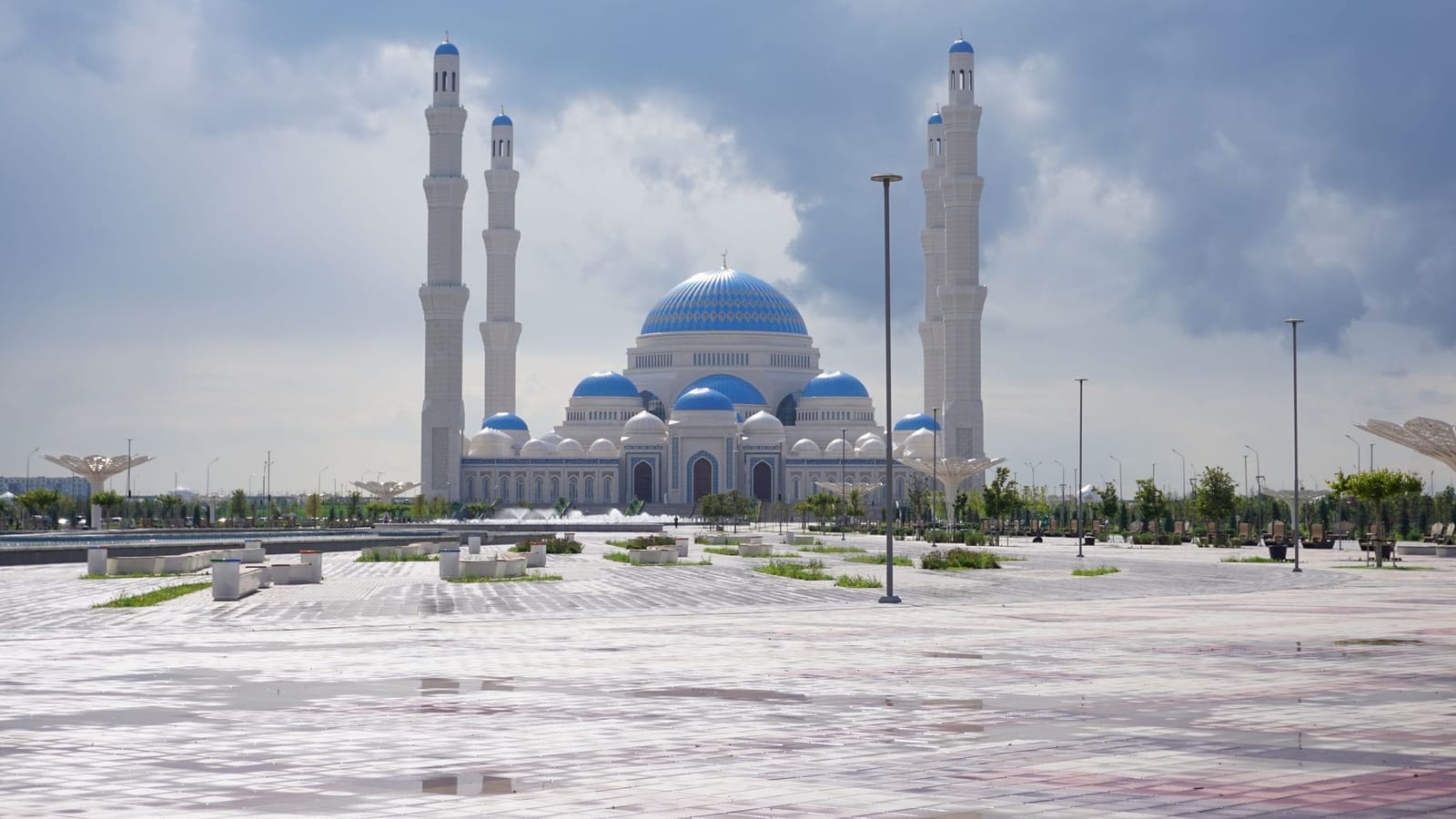 Stunning view of the Sultan Hazrat Mosque against a cloudy sky in Astana, Kazakhstan.