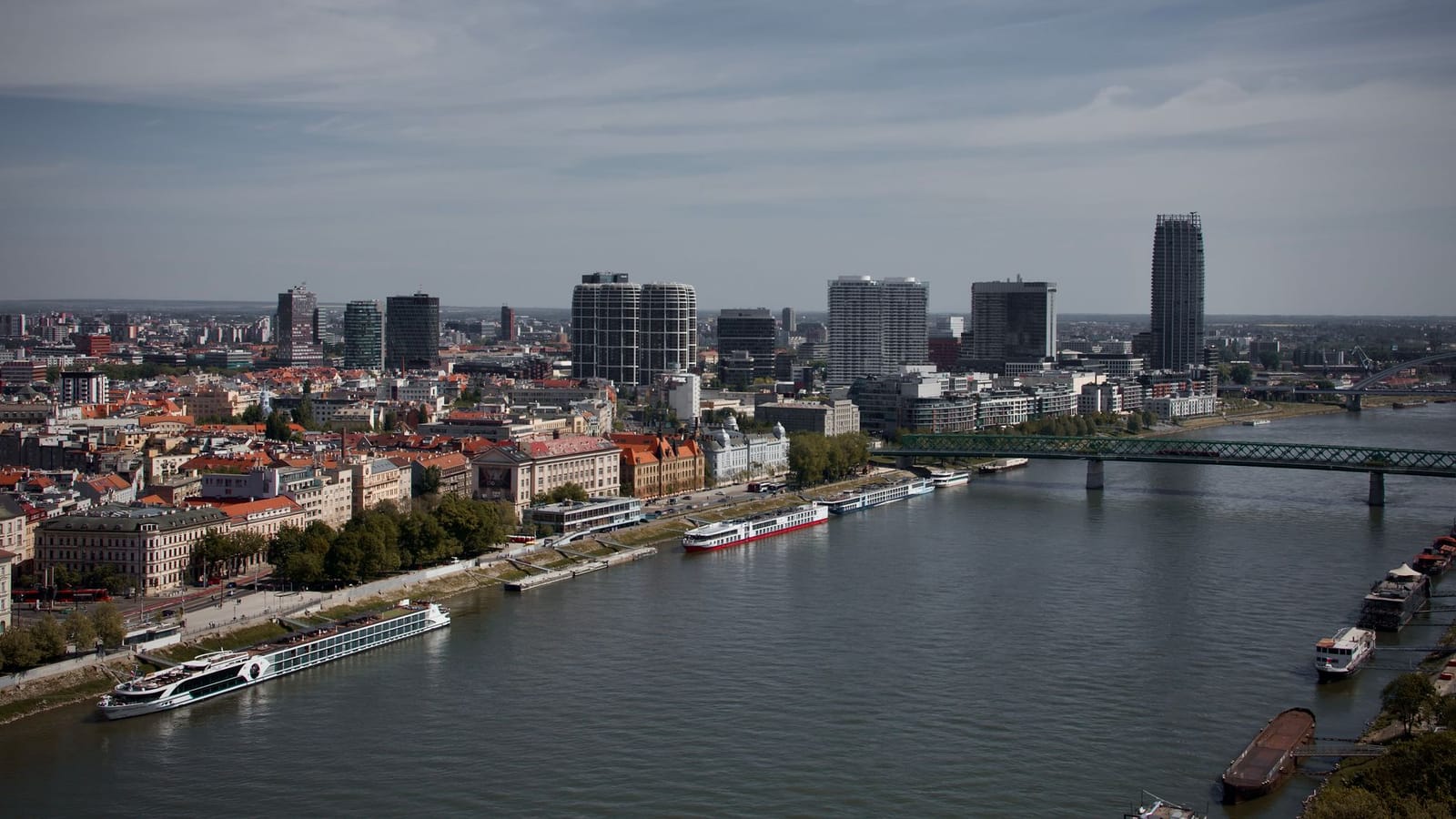 Stunning aerial view of Bratislava's skyline with modern architecture and the Danube River.