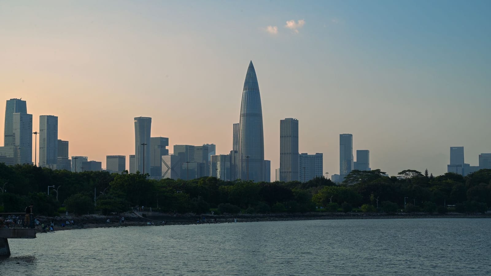 Scenic view of Shenzhen skyline during sunset with waterfront.