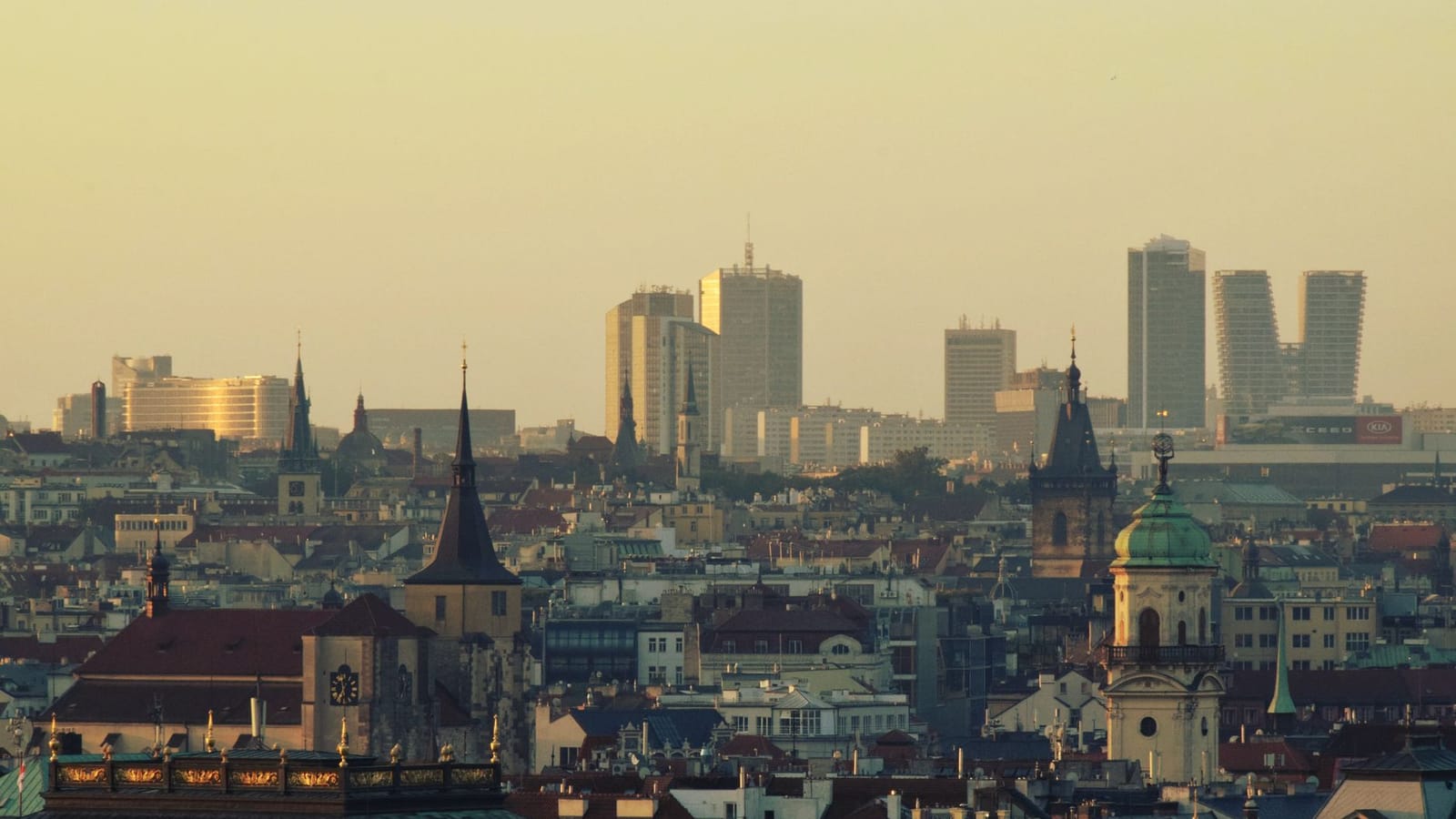 Stunning cityscape of Prague at sunset, showcasing a blend of historic and modern architecture.