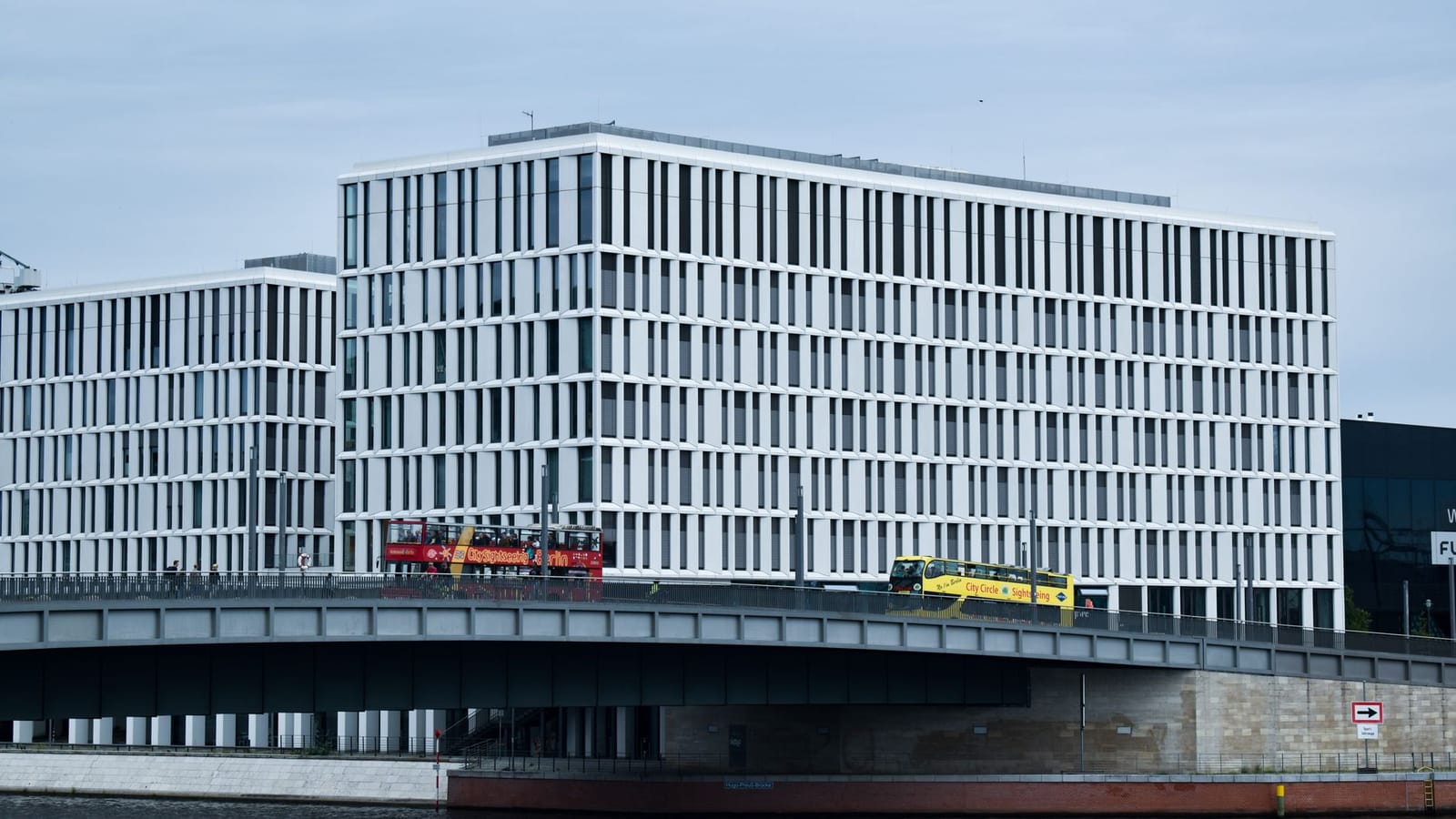 A contemporary office building with glass facade in Berlin, Germany, showcasing modern architecture.