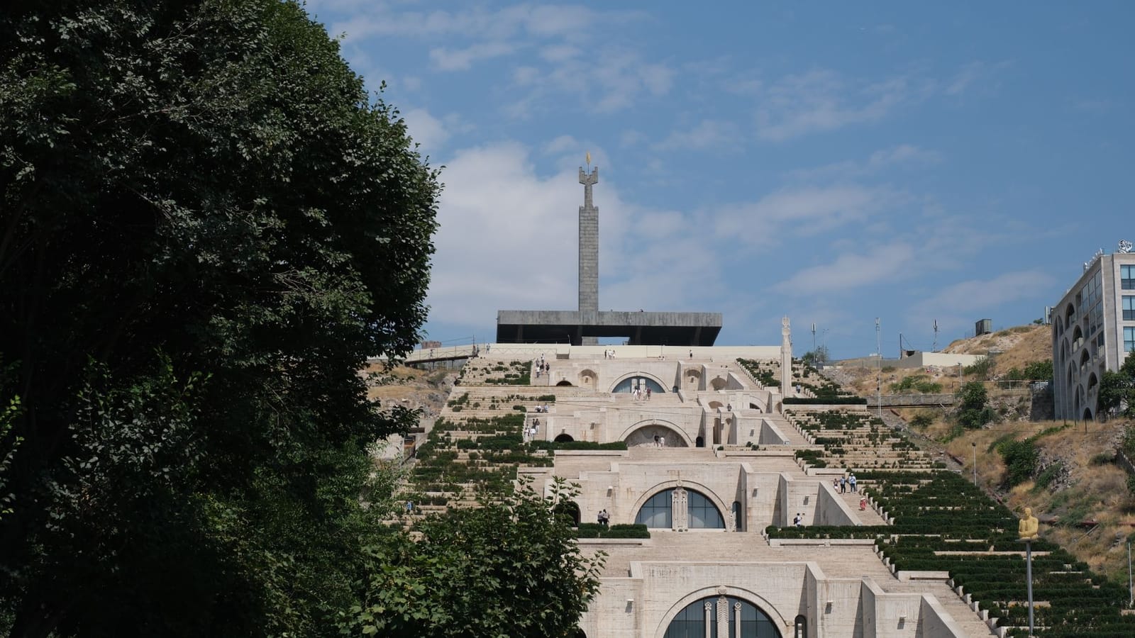 Scenic view of the iconic Cascade Complex in Yerevan, Armenia, under a clear blue sky.