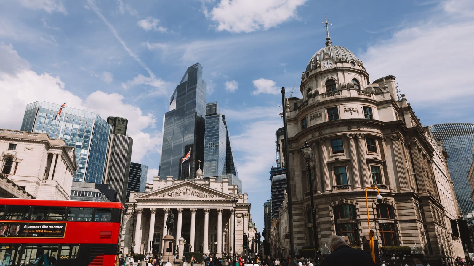 Vibrant street view of London's skyline featuring modern skyscrapers and historic architecture.