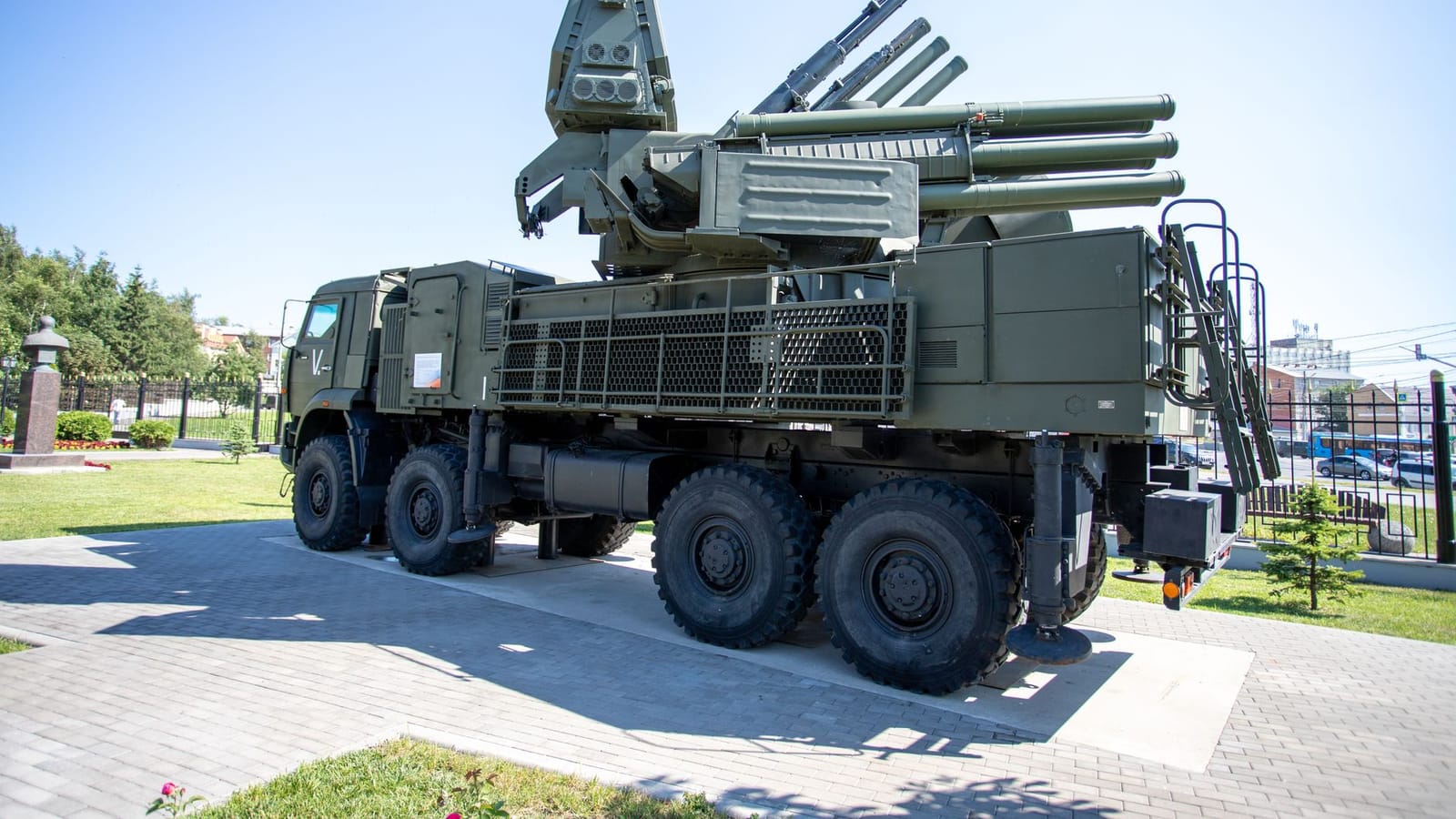 Outdoor display of a military missile defense system on a sunny day, highlighting its structure.