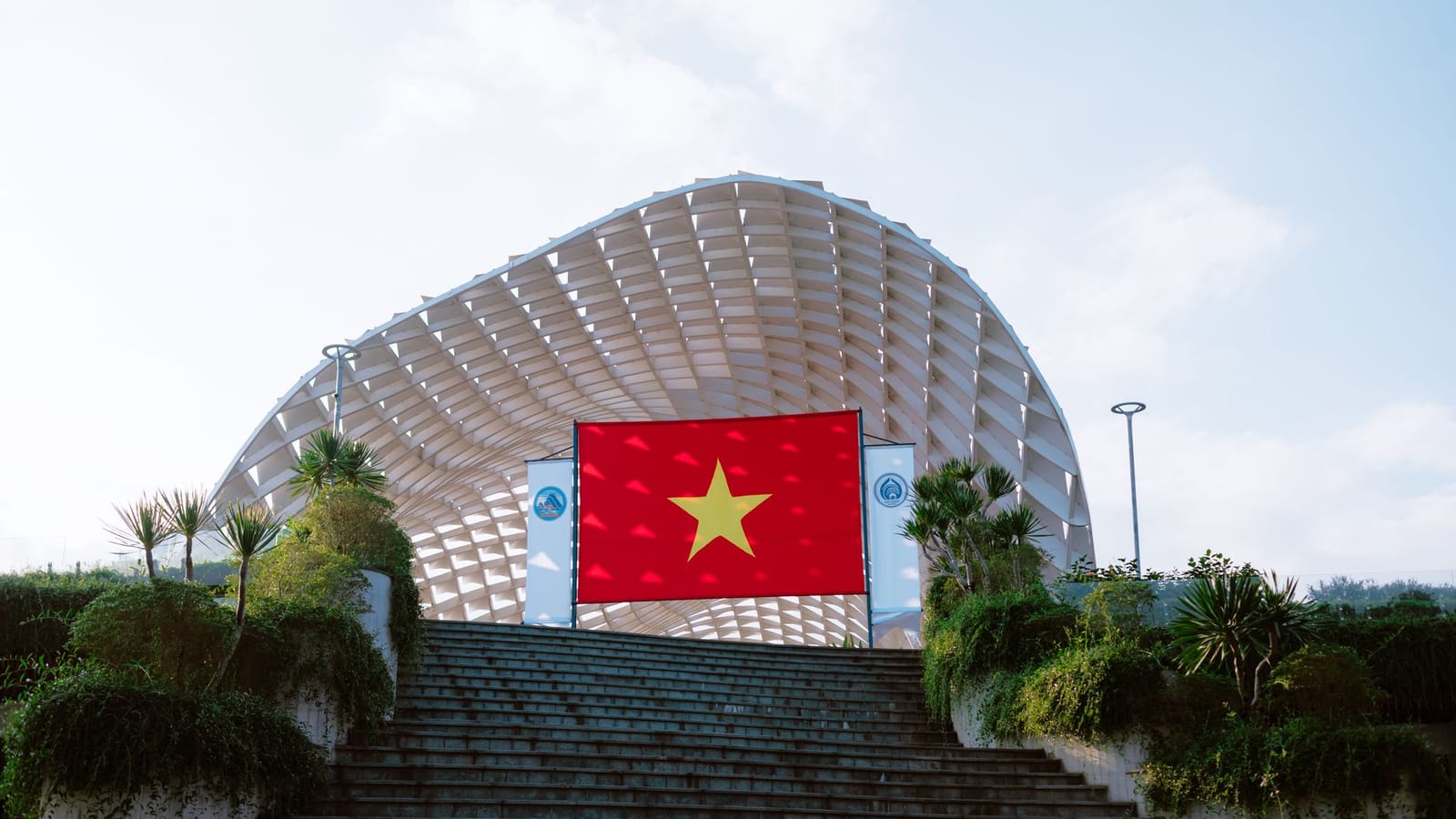 Vietnamese flag at a prominent architectural structure in Đà Nẵng.
