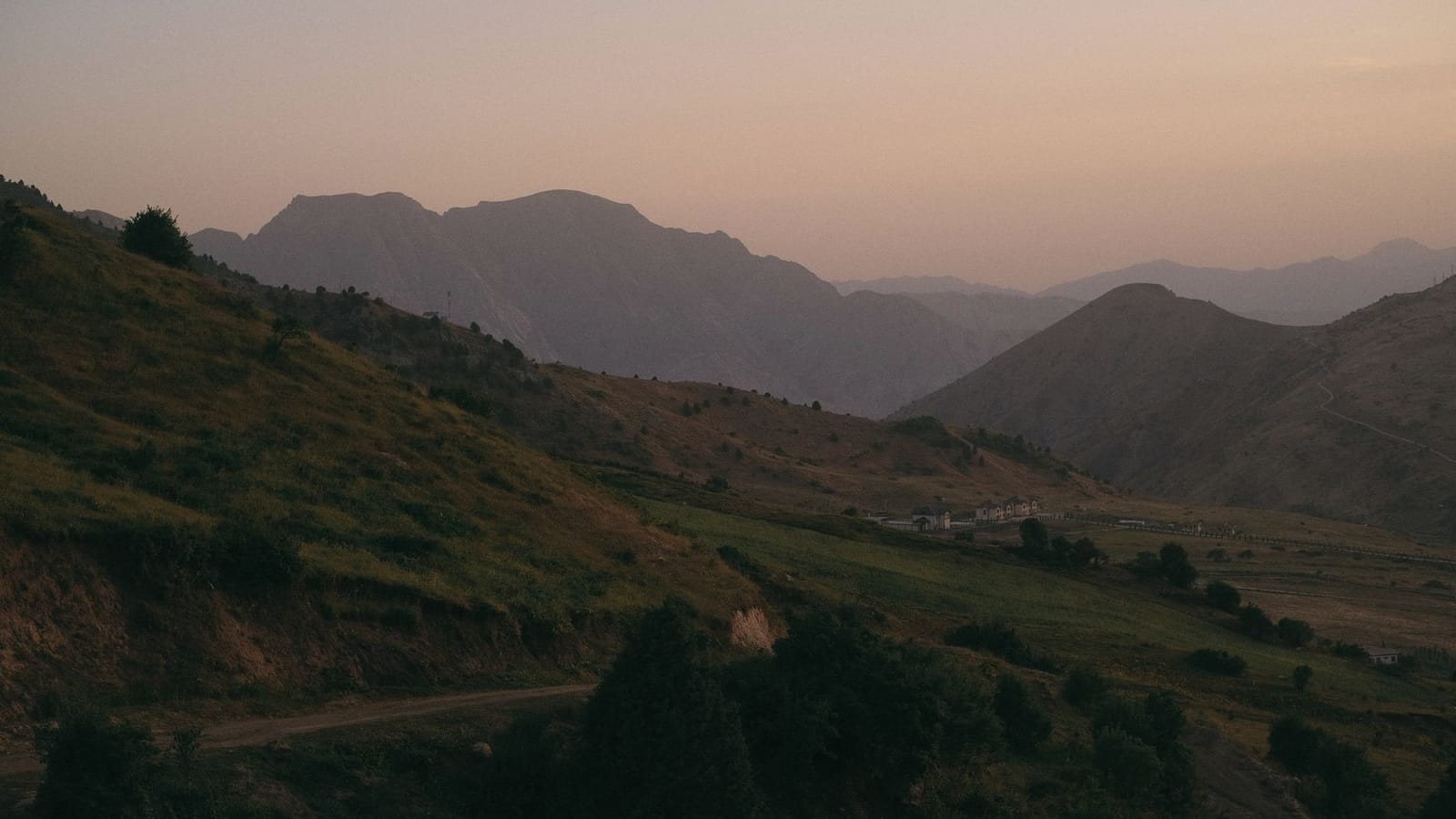 Scenic view of misty mountains and valleys at dawn in Dushanbe, Tajikistan.