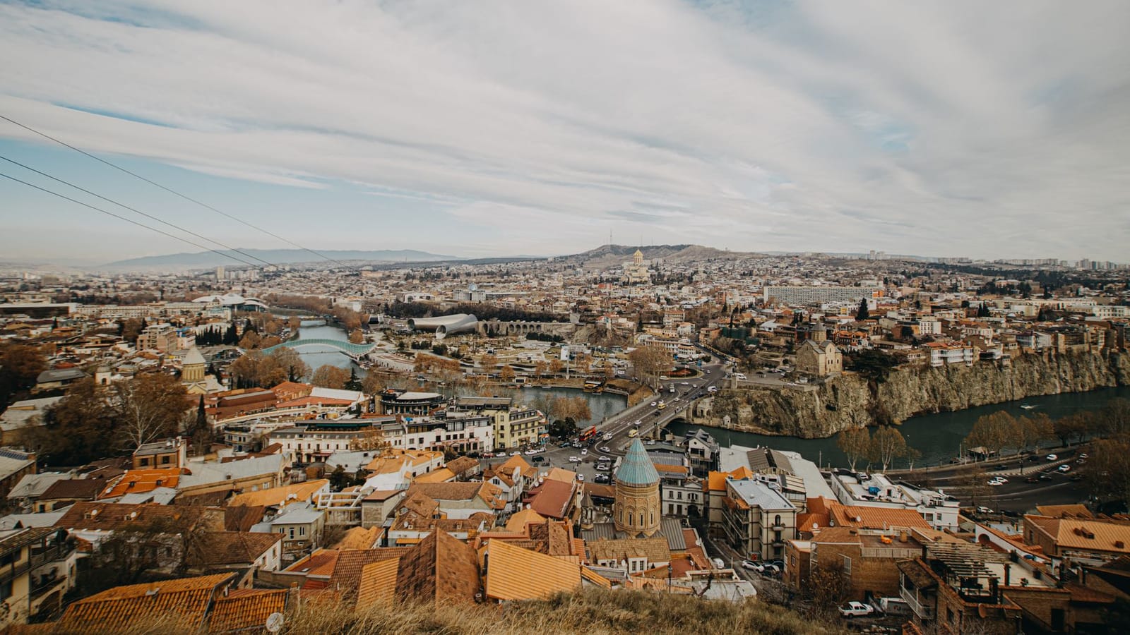 Breathtaking aerial view of Tbilisi showcasing its historic architecture and urban landscape.