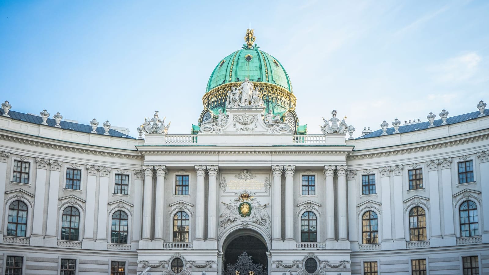 Front view of the majestic Hofburg Palace exterior in Vienna, Austria showcasing its grand architecture.