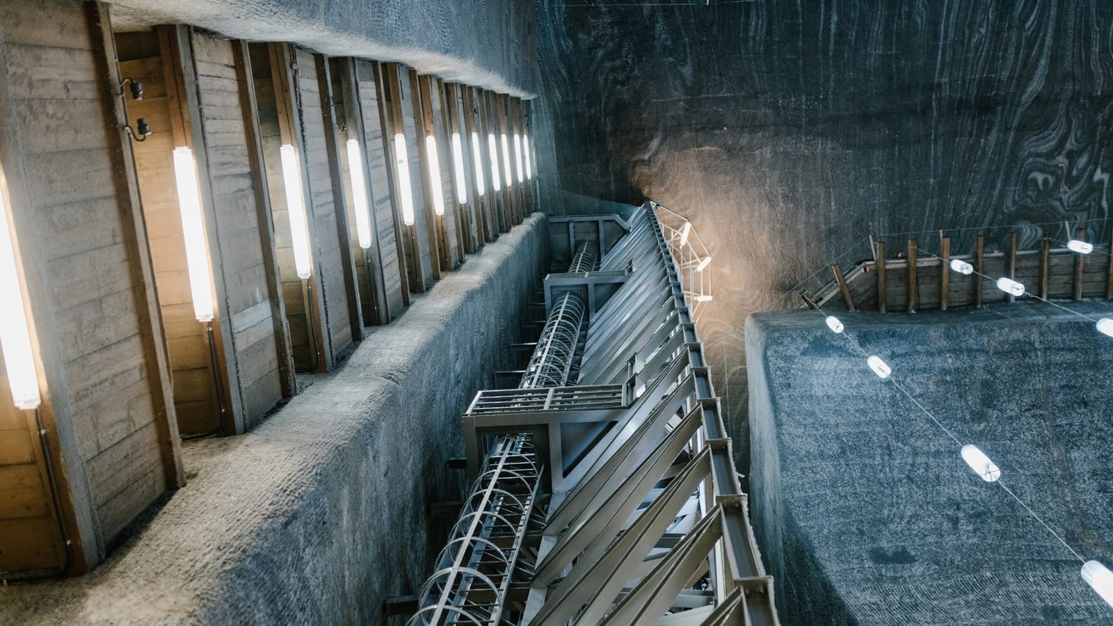 Metal constructions and LED lamps in underground hall of Salina Turda salt mine in Romania