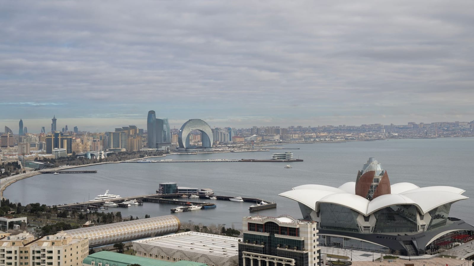 Scenic aerial view of Baku, Azerbaijan overlooking the Caspian Sea with iconic architecture and urban landscape.