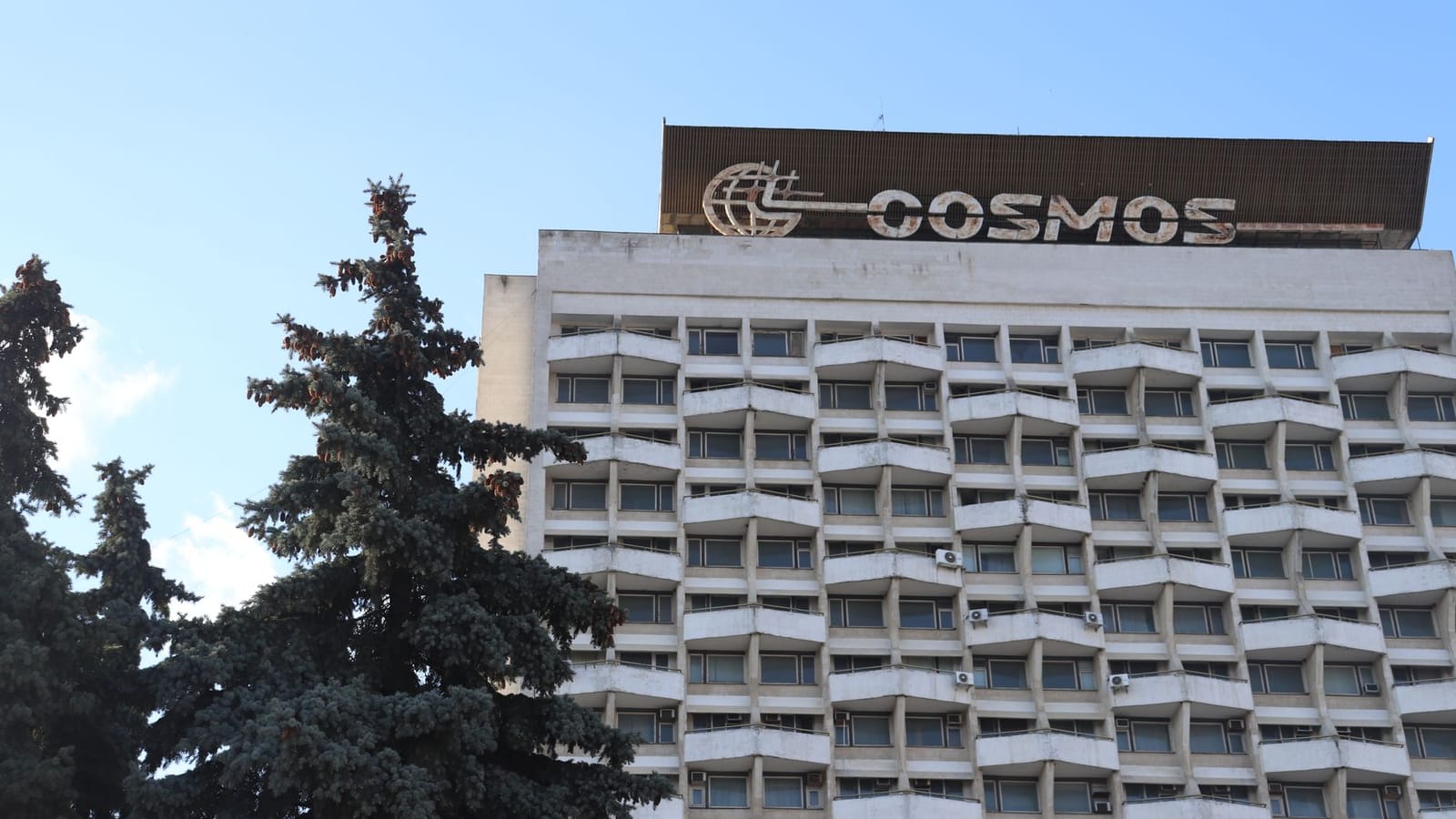 A classic view of the iconic Cosmos Hotel in Chișinău, Moldova against the blue sky.