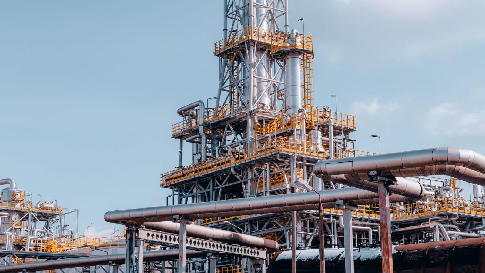 View of a large oil refinery plant with intricate pipelines in Trzebinia, Poland.