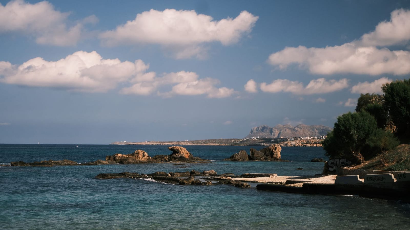 Stunning view of the rocky shoreline and blue sea in Crete, Greece.